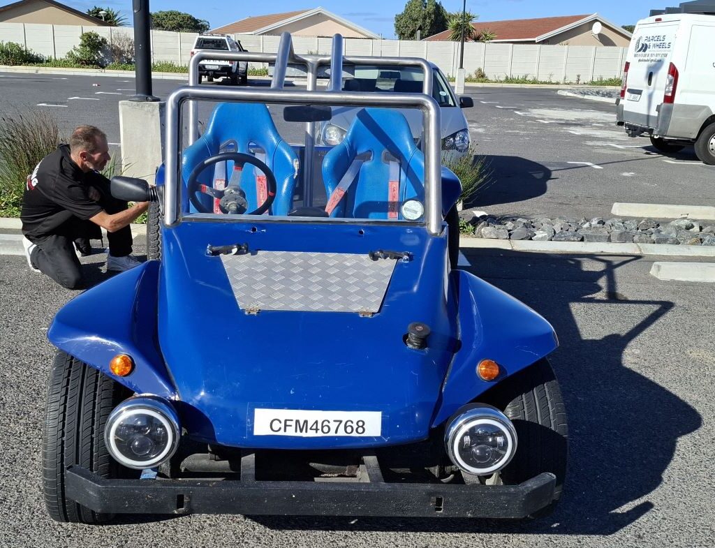 Striking blue Beamish Beach Buggy cruising along the Cape coastline during the Cape Buggy Tour 2025.