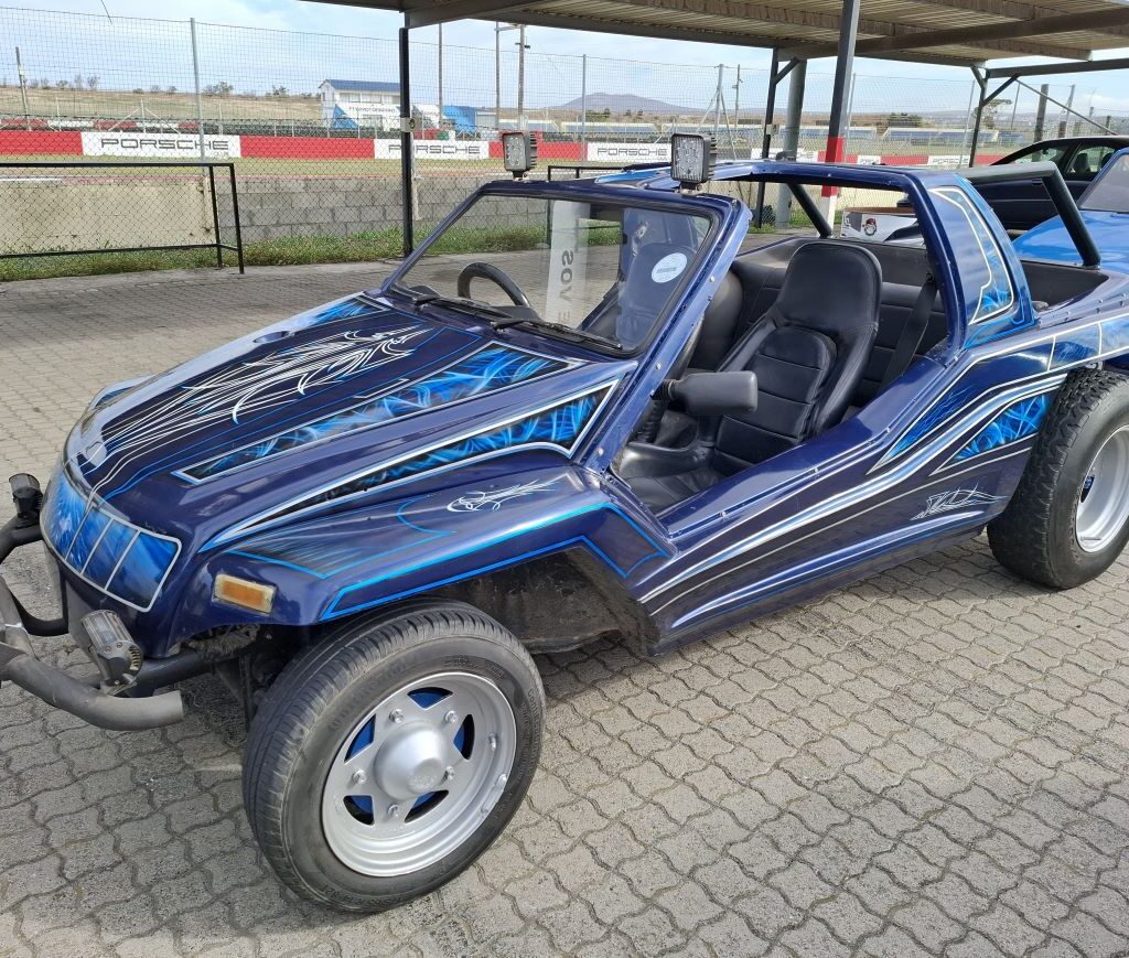 Lerene Sadie's vibrant blue Kango beach buggy with an exceptional spray paint job, showcased at the Wild Buggers Reach for a Dream charity run.