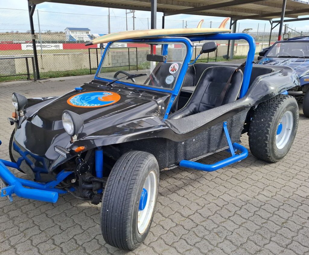 Clive Cohen's black Beamish beach buggy, nicknamed "Highway Surfer," showcased at the Wild Buggers Reach for a Dream charity run.