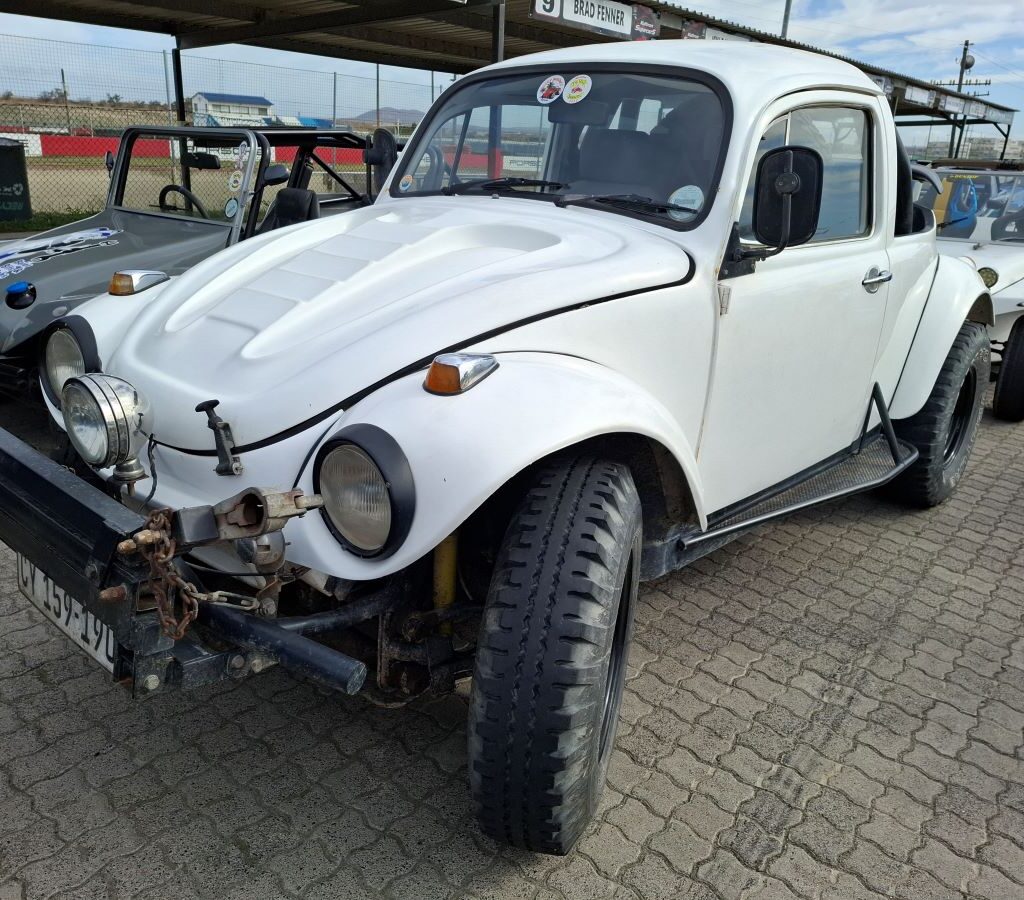 Andre Welsh's white Baja Bug bakkie conversion at the Wild Buggers Reach for a Dream charity run, showcasing its unique truck-like bed.