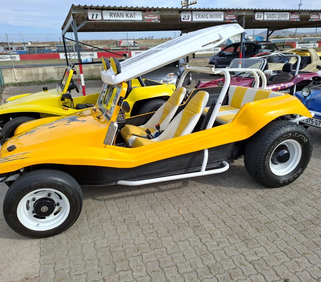 Chris Zara's bright yellow Salamander beach buggy, affectionately known as "Zara's Bug," at the Wild Buggers Reach for a Dream charity run.