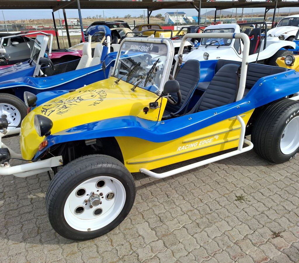 Hannes Swanepoel's striking yellow and blue Beamish beach buggy, nicknamed "The Fish Reaper," showcased at the Wild Buggers Reach for a Dream charity run.