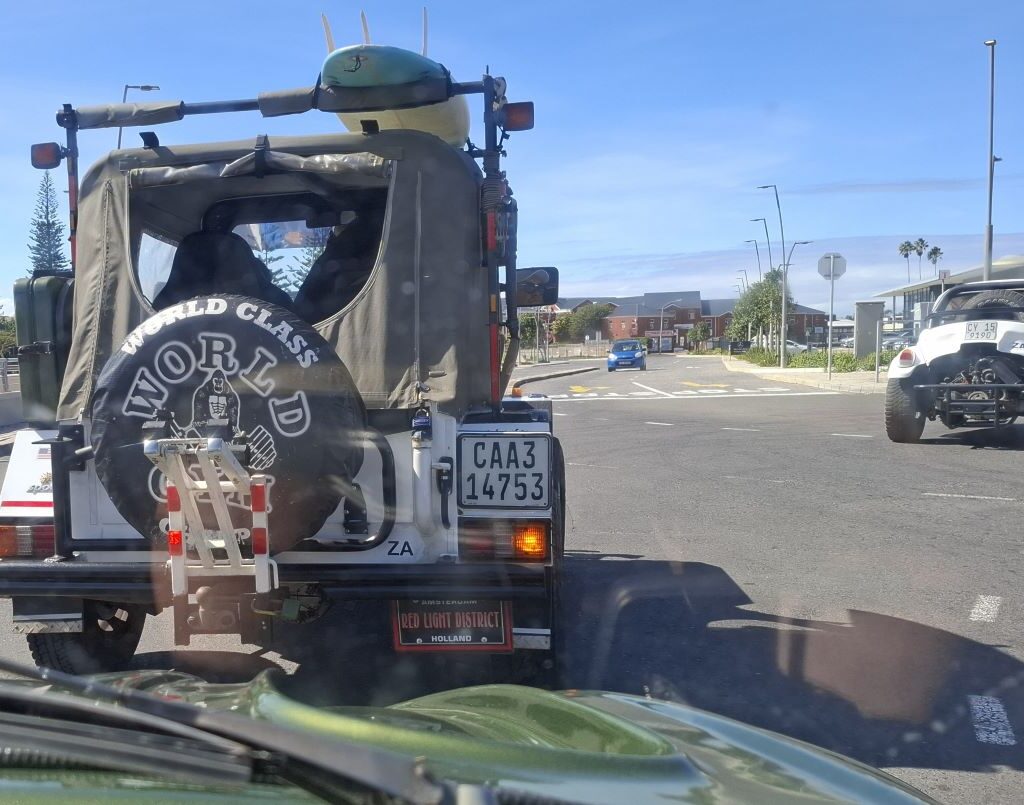 Beach buggies driving along an open road during the Cape Buggy Tour 2025.