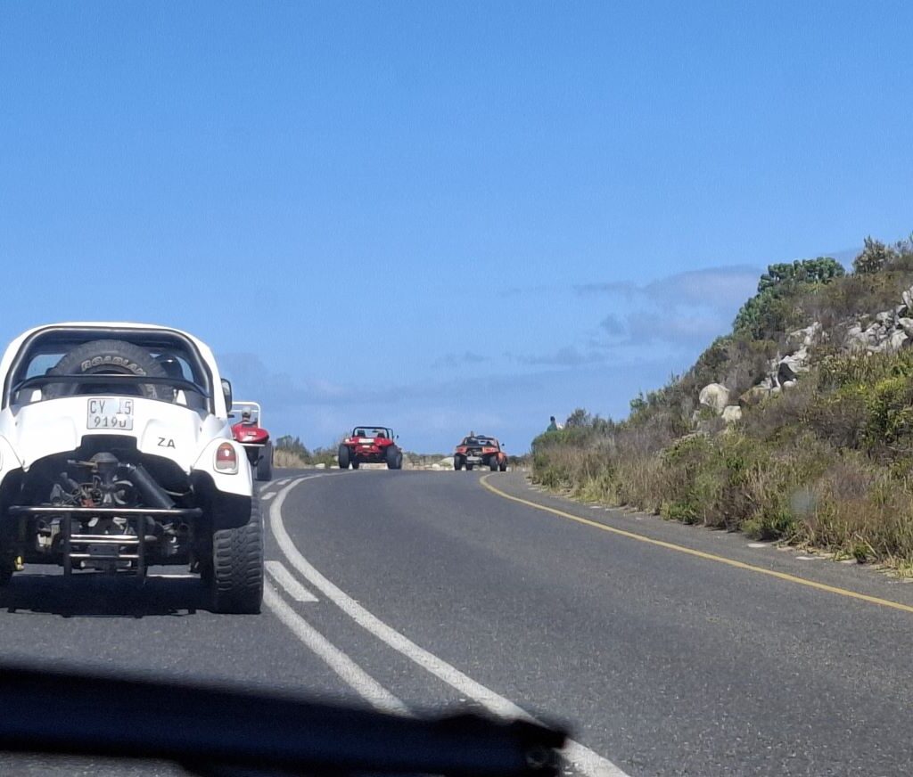 Beach buggies driving through scenic mountain roads during the Cape Buggy Tour 2025.