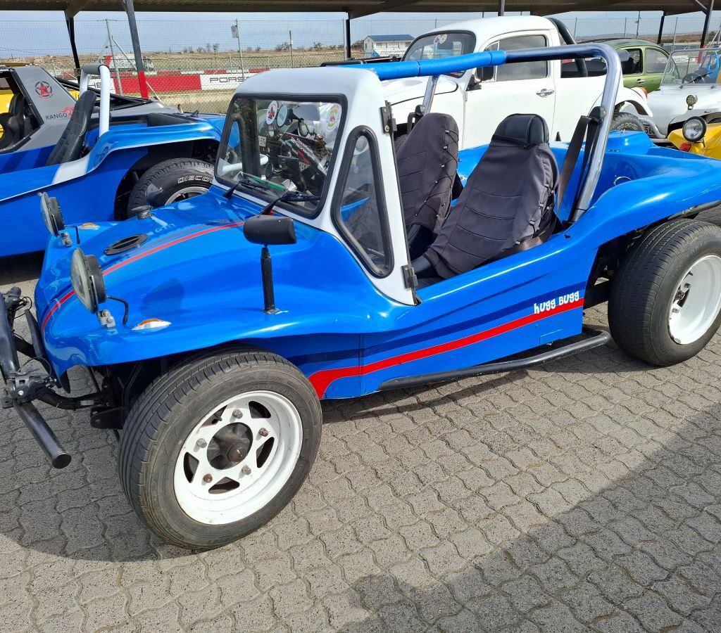 Jessie Huggett's vibrant blue Kestrel KartKraft beach buggy, affectionately known as "Hugg Bugg," at the Wild Buggers Reach for a Dream charity run.