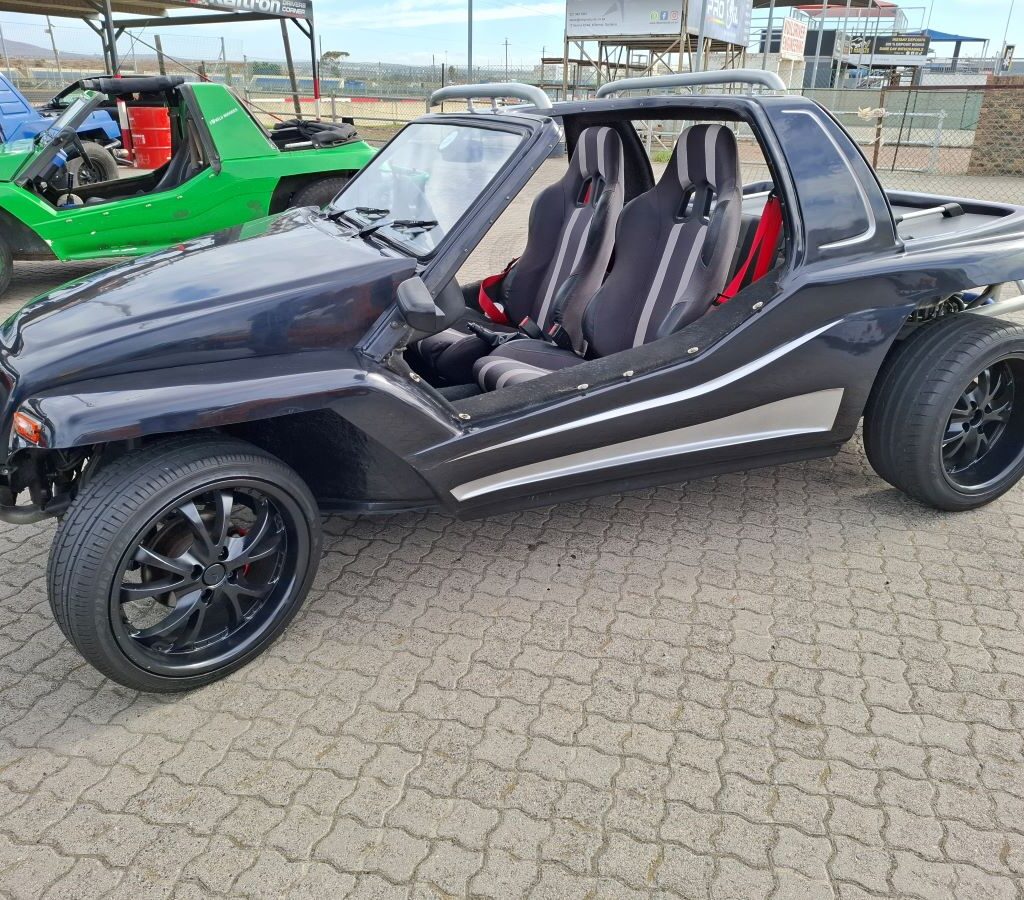 A sophisticated black Kango beach buggy showcased at the Wild Buggers Reach for a Dream charity run.