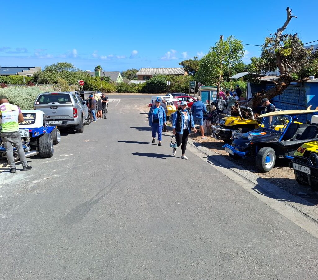 Beach buggy convoy waiting during Cape Buggy Tour 2025 while photographer captures the moment.