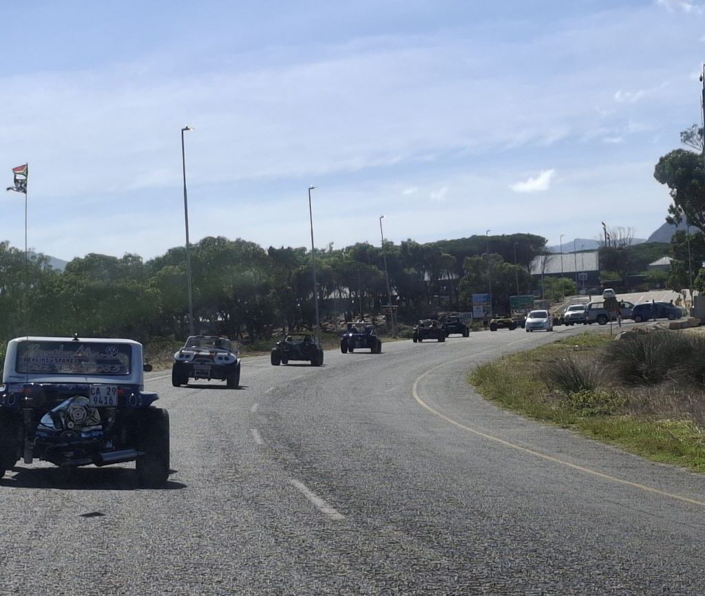 Beach buggies cruising through Misty Cliffs on the Cape Buggy Tour 2025, with stunning cliffs and coastline views.