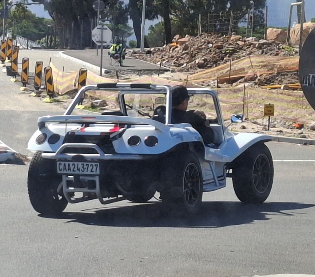 Beach buggies driving along the road, capturing the essence of the Cape Buggy Tour 2025 journey.