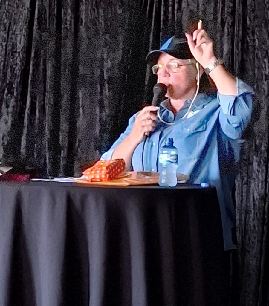 A photo of Michelle Jenkins, the charity organizer, giving a speech at the Wild Buggers Reach for a Dream event.