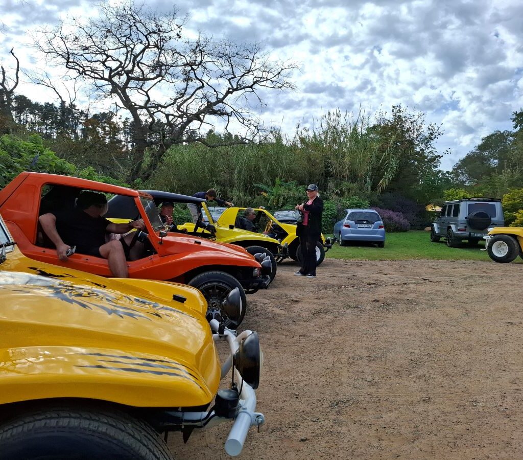 Wild Buggers Beach Buggies are neatly parked in rows at Helderberg Farm, the milkshake stop, with club members seen getting out of their vehicles and stretching their legs, eager for refreshments during Wiehann's Run.