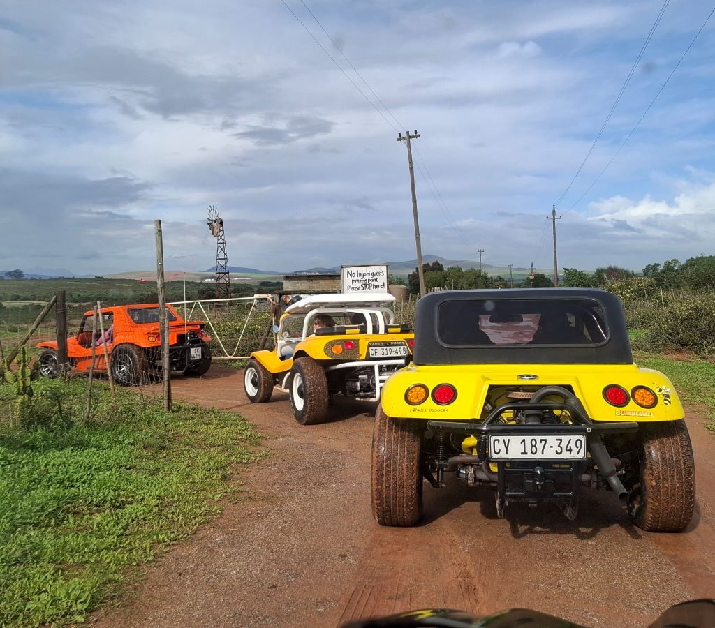 Brent, Chris, and Anthony in their Beach Buggies turning onto the road leading to the "Mauritius" destination during The Wild Buggers' Tony & Sue's Run.