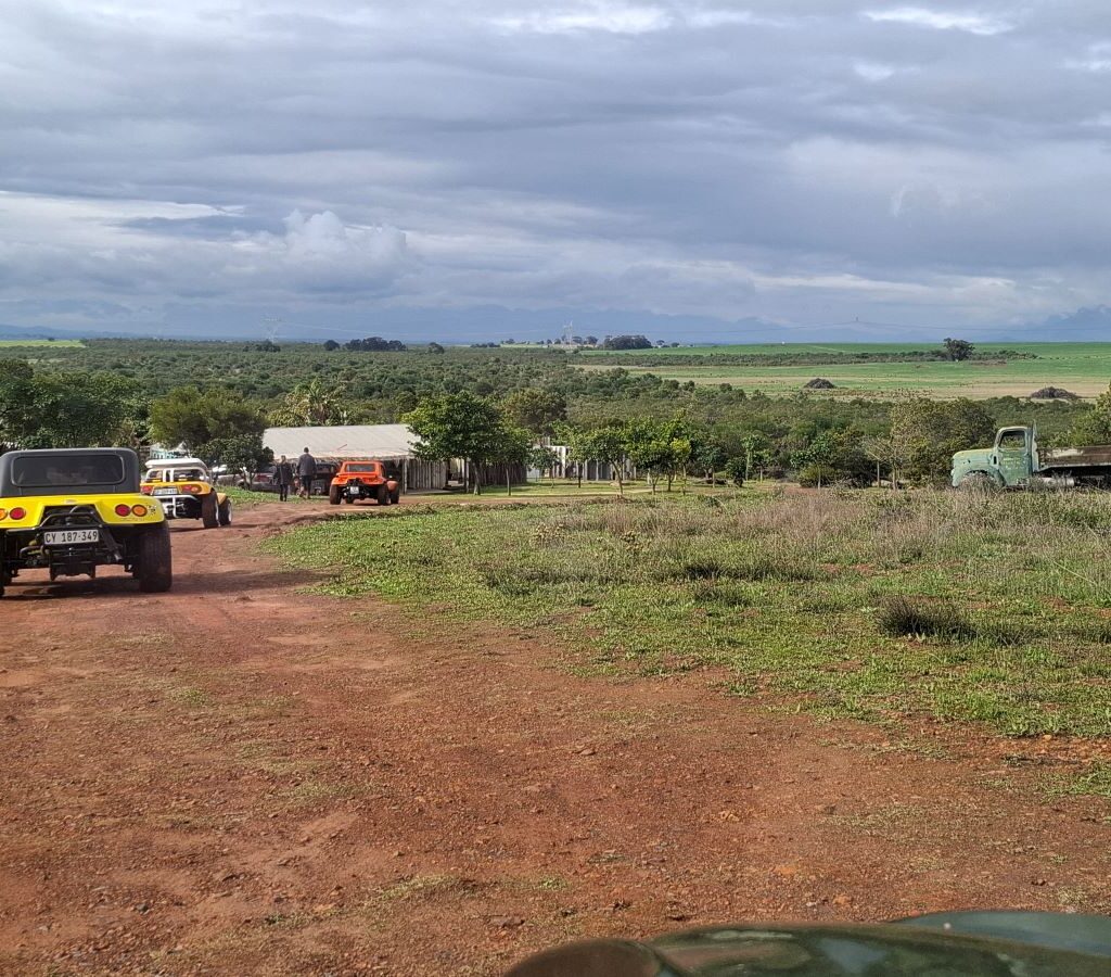Wild Buggers Beach Buggies and VW air-cooled vehicles driving on a road, almost at their "Mauritius" destination during Tony & Sue's Run.
