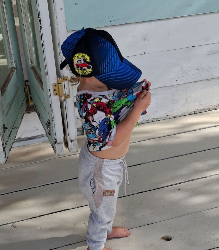 A close-up of a "Wild Buggers" branded cap, representing The Wild Buggers Beach Buggy Club, worn during Tony & Sue's Run.