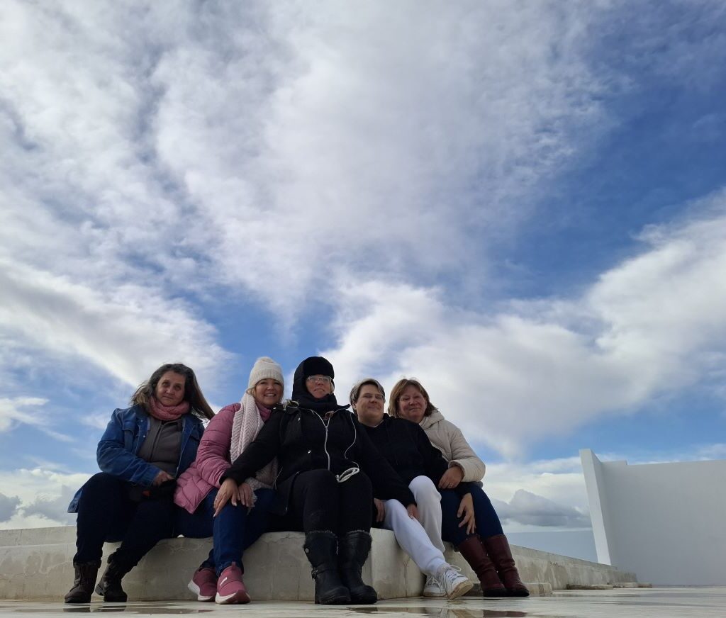 A beautiful photo of the ladies of The Wild Buggers Beach Buggy Club posing in the "Morocco" themed part of Tony & Sue's Run.