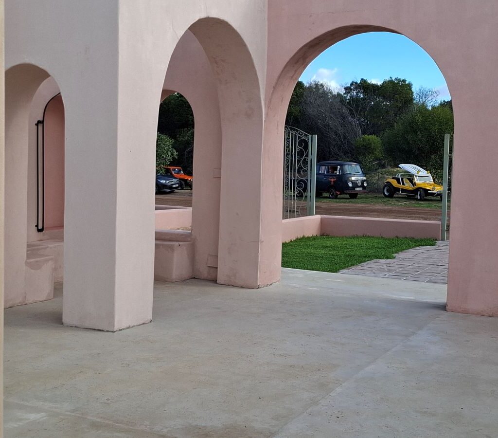 A view from inside the "Morocco" themed area, showing Wild Buggers' old school VW air-cooled vehicles including Beach Buggies and VW Beetles parked just outside.