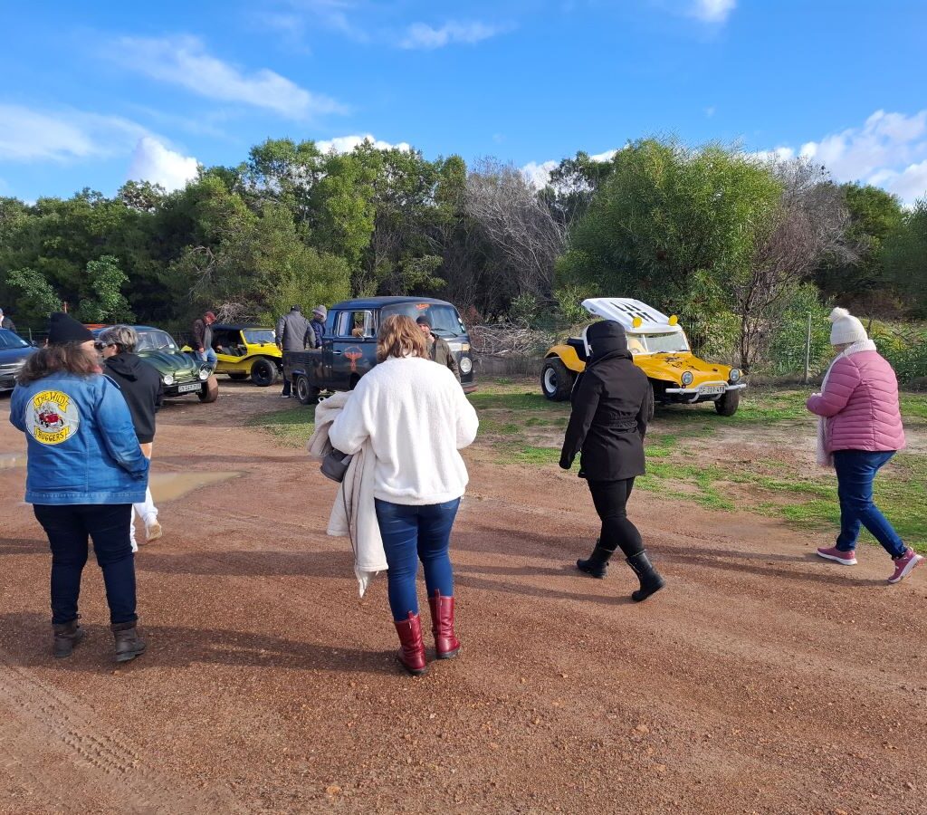 Wild Buggers club members walking back towards their VW air-cooled vehicles and Beach Buggies after exploring the "Morocco" themed area during Tony & Sue's Run.