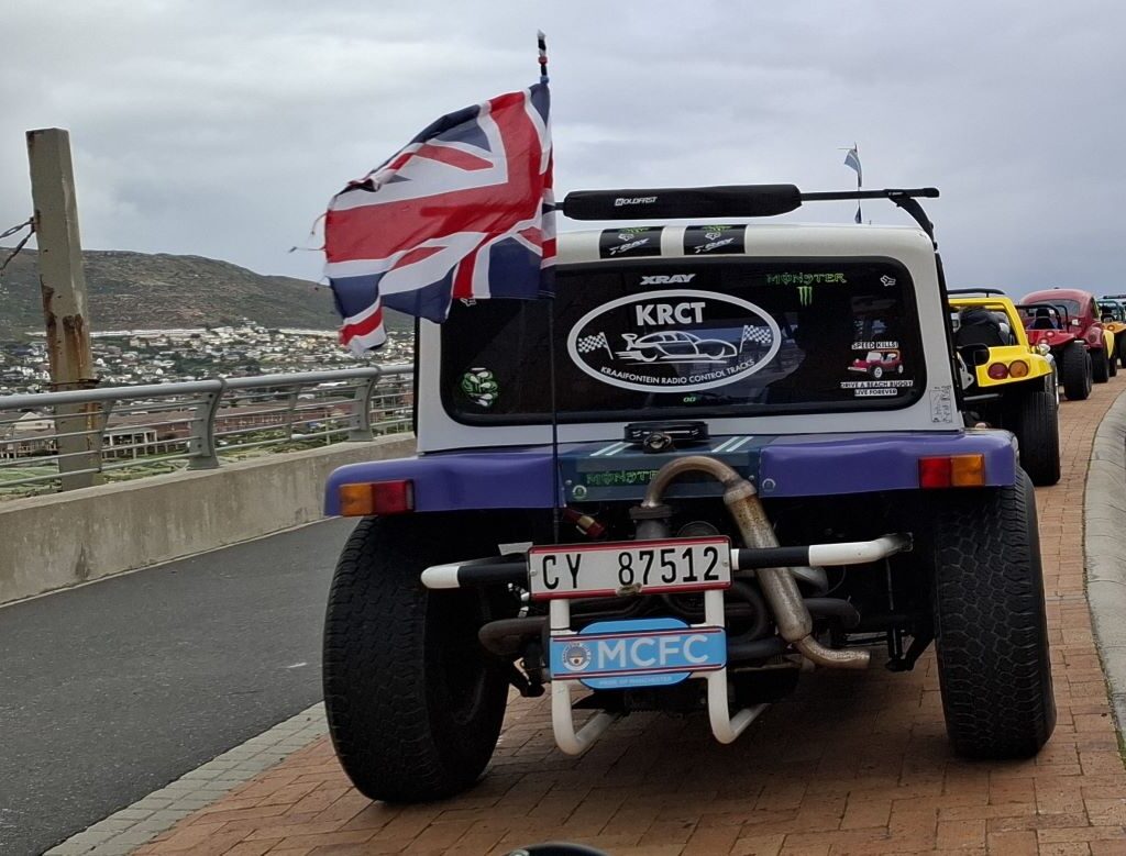 Group of diverse beach buggies at another pitstop during Wild Buggers 'Revving Up for the Lens' cruise
