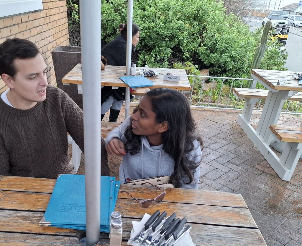 Cale and Reece, journalist students, planning next photo shoot while waiting for food at Dixies during Wild Buggers 'Revving Up for the Lens' event