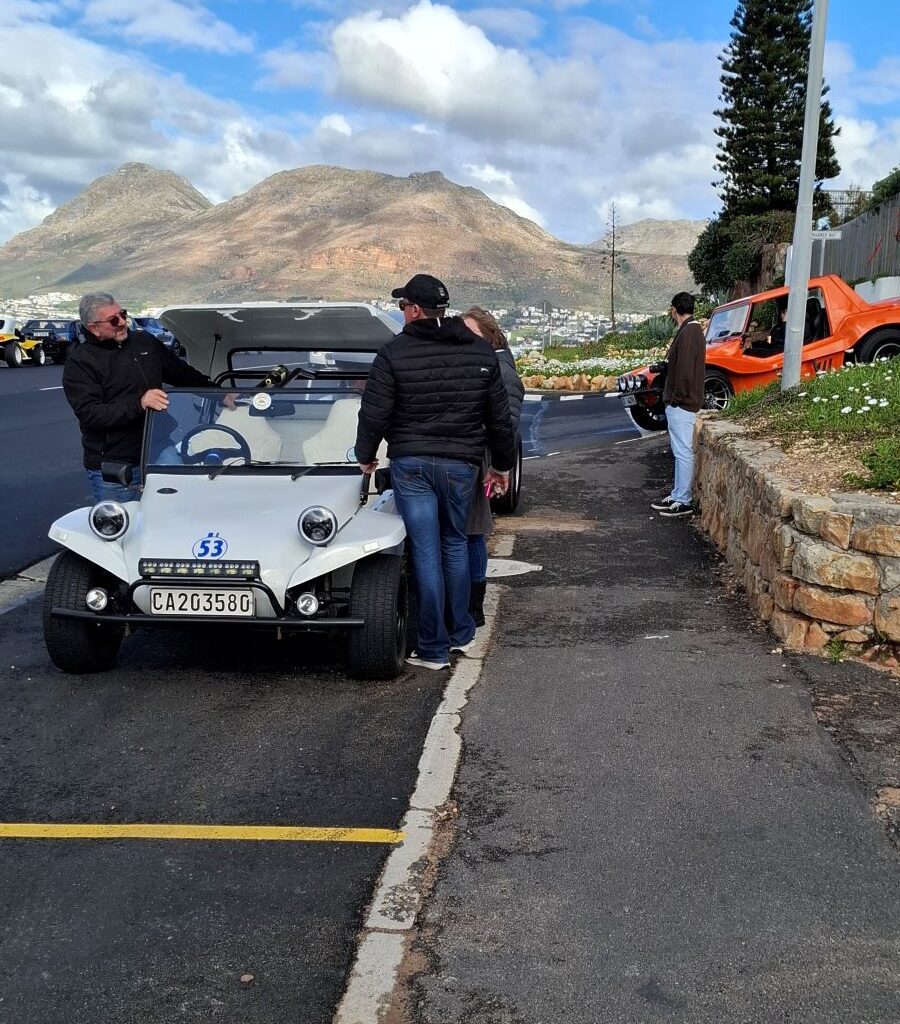 Brent and Nick chatting next to Nick's white Herbie 53 VW Beamish beach buggy