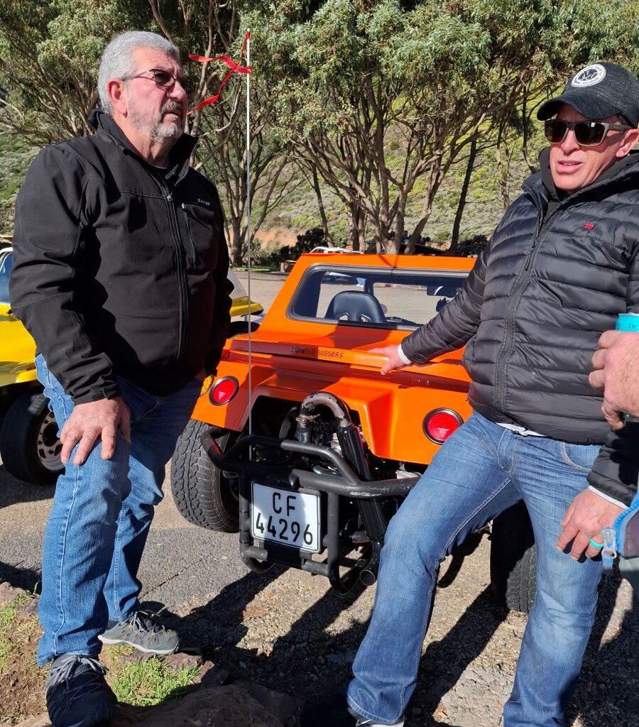 Brent and Nick chatting next to Brent & Sam's orange VW Salamander beach buggy 'The Wasp'