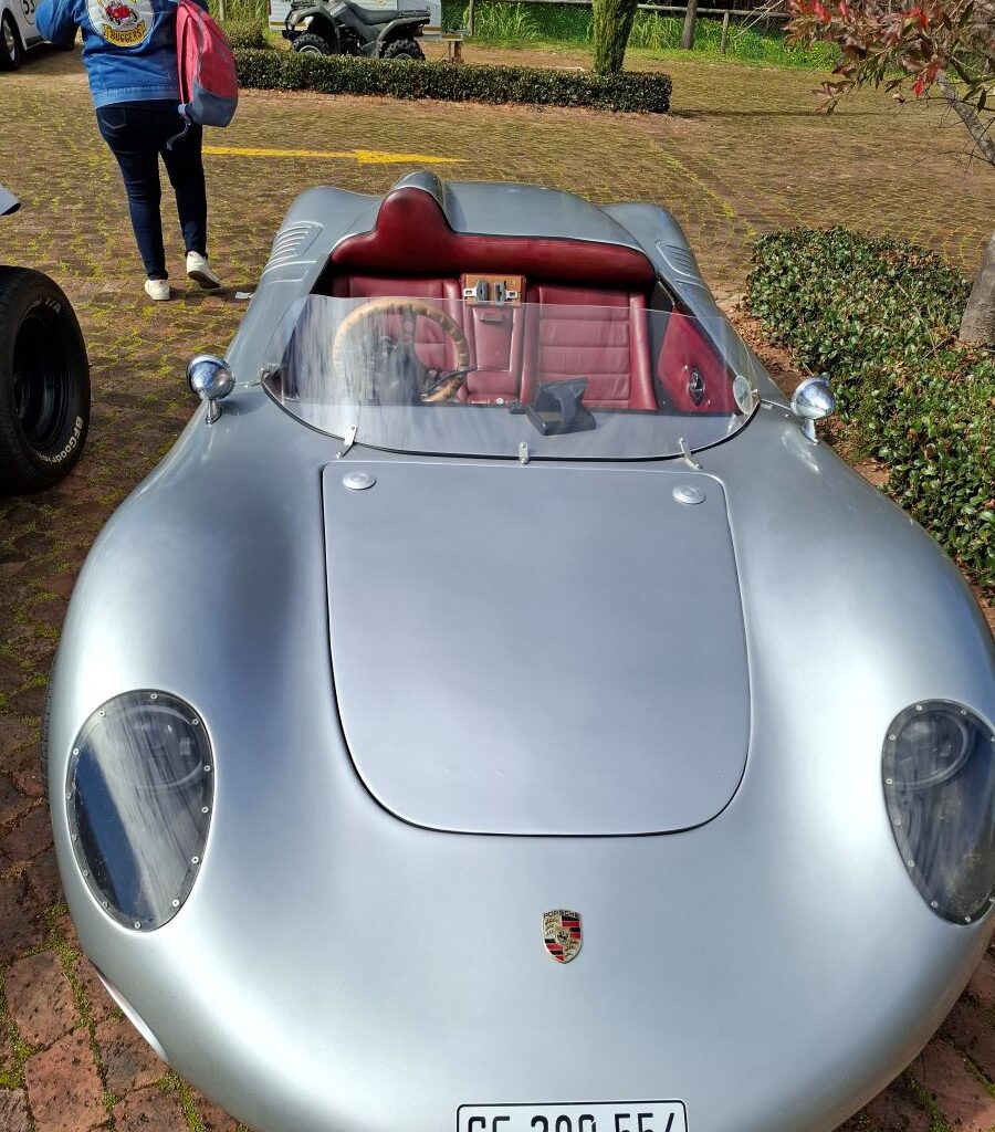 A photo of Shane Flint's awesome Porsche, a classic car that shares a heritage with the VW air-cooled family, parked during a Wild Buggers club run.