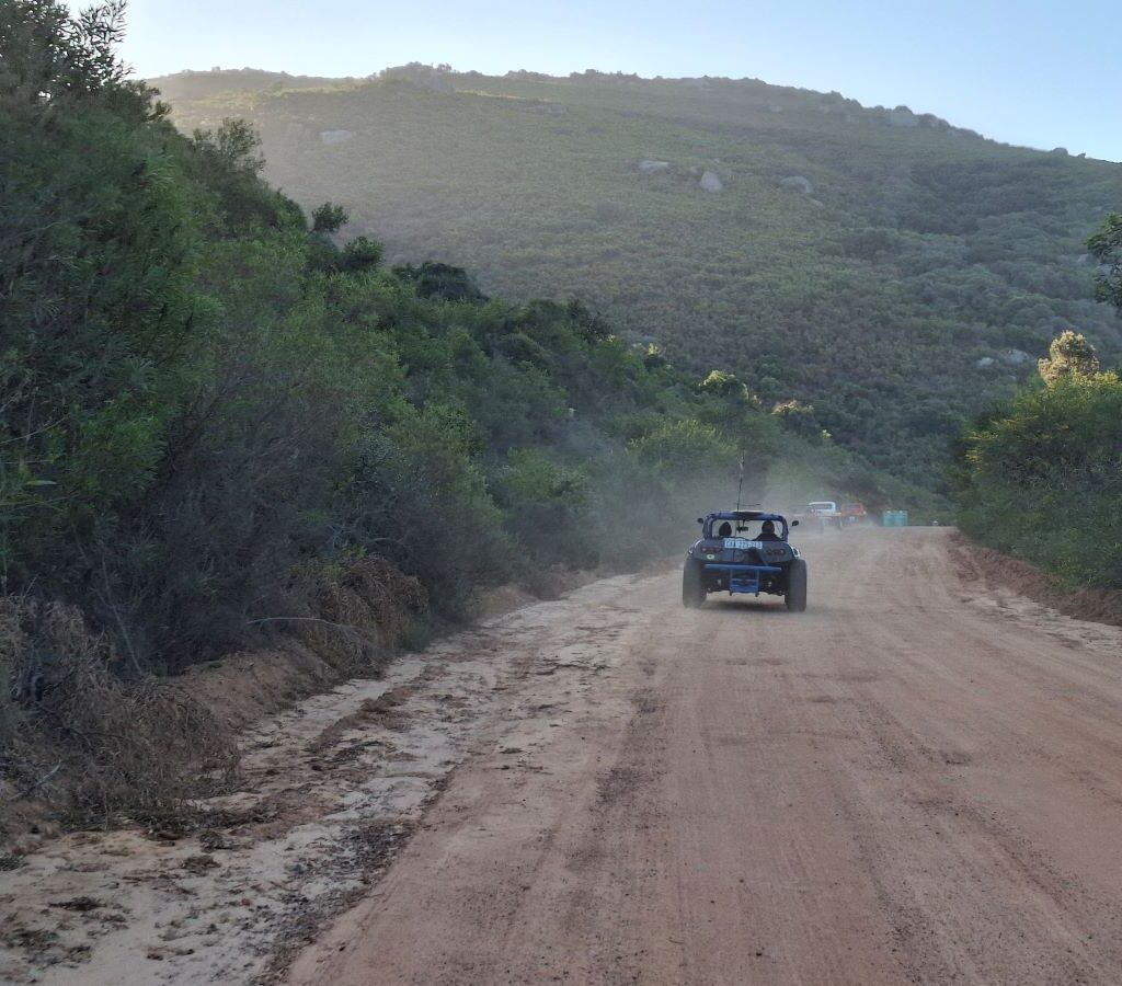 An exhilarating, scenic photo from inside a beach buggy showing the beautiful road winding ahead, capturing the feeling of freedom and the pure joy of the drive during the Wild Buggers Beach Buggy Club's outing.