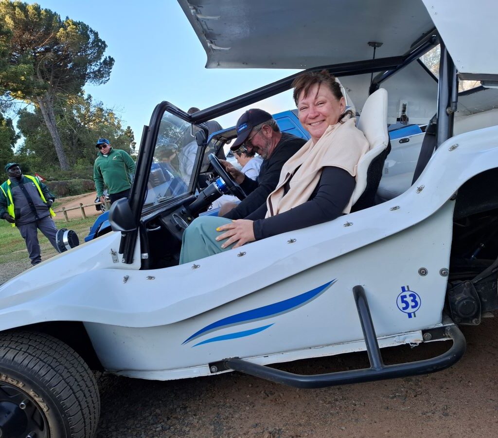 A hilarious and slightly dramatic photo showing Sandra and Nick in 53 (their white Beamish beach buggy) at the closed gates of the Paarlberg picnic spot, being turned away by a gatekeeper, as the Wild Buggers' sundowner plans hit another snag.