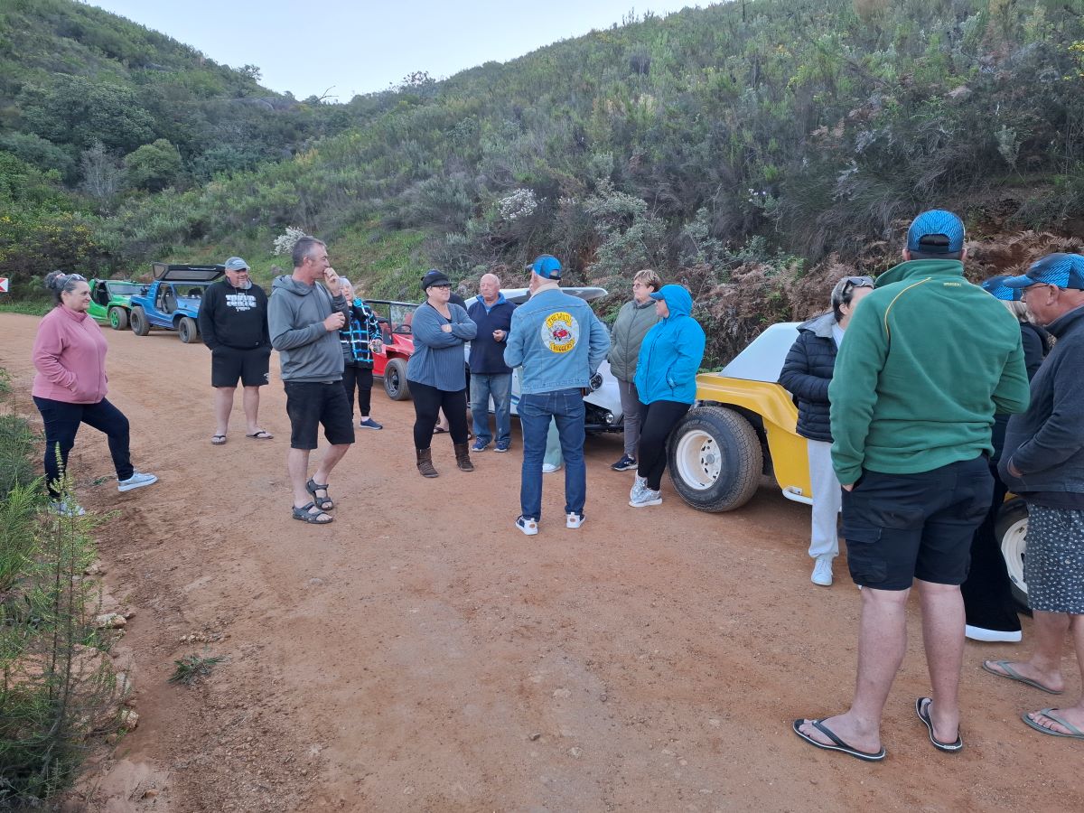 Members of The Wild Buggers Beach Buggy Club enjoying a sundowner on Paarlberg before heading back to camp in their beach buggies and classic VWs.