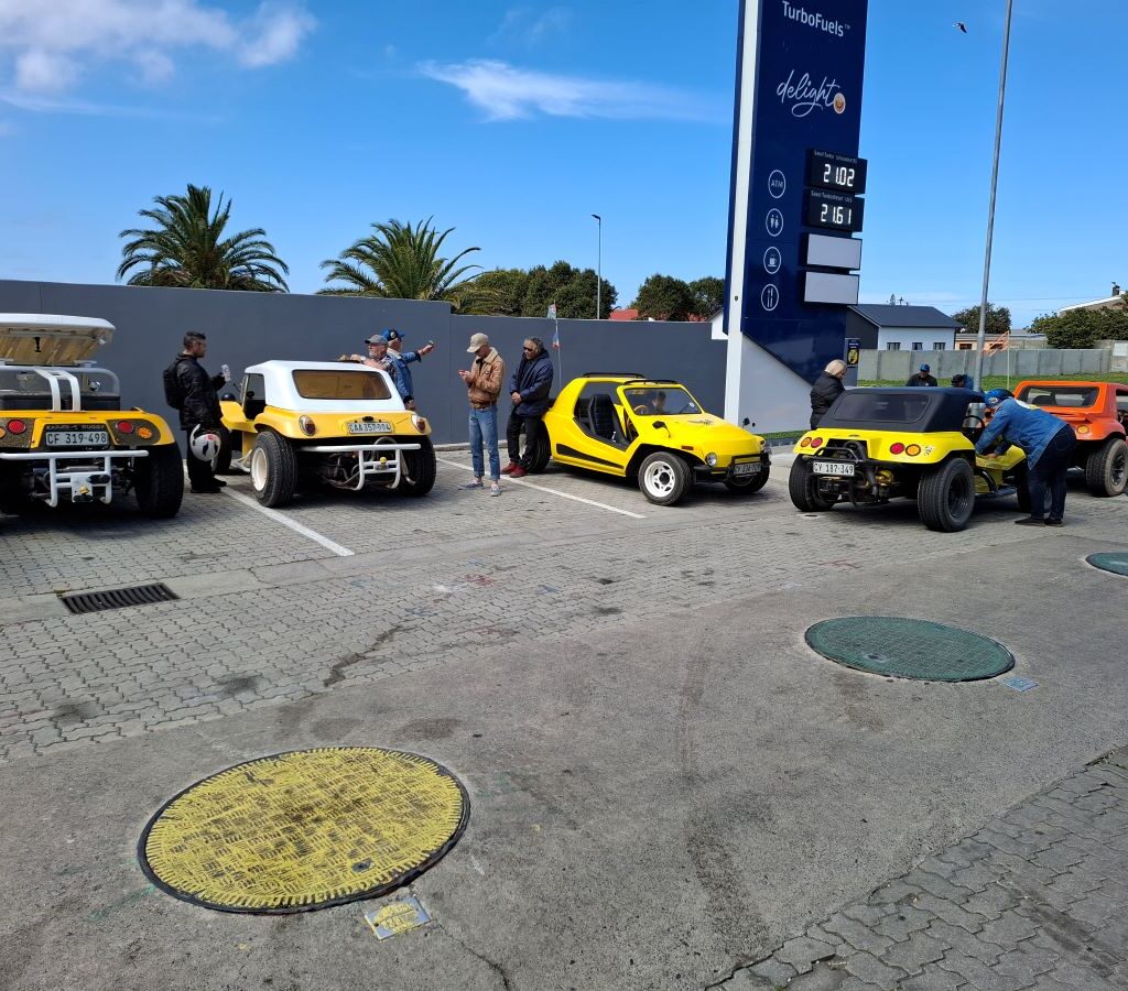 Wild Buggers members and their VW Air cooled vehicles are at a garage in Kleinmond for a quick break and chat.