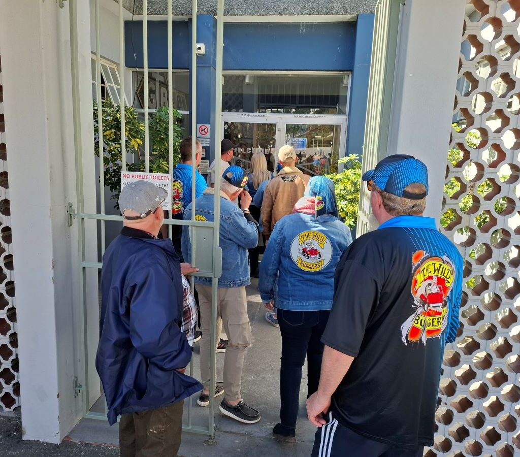 Wild Buggers club members are seen walking into the Gordon's Bay Yacht Club after a road trip.