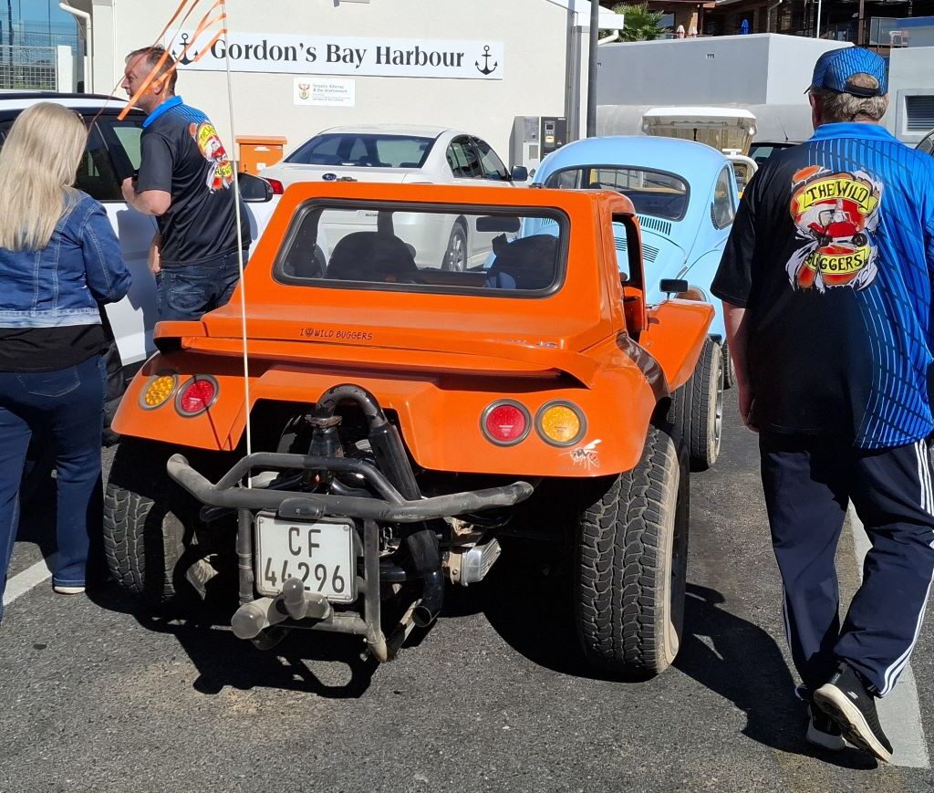 Brent's VW Beach Buggy, "The Wasp," is parked as members of the Wild Buggers club walk past it to return to their own VW Air cooled vehicles.