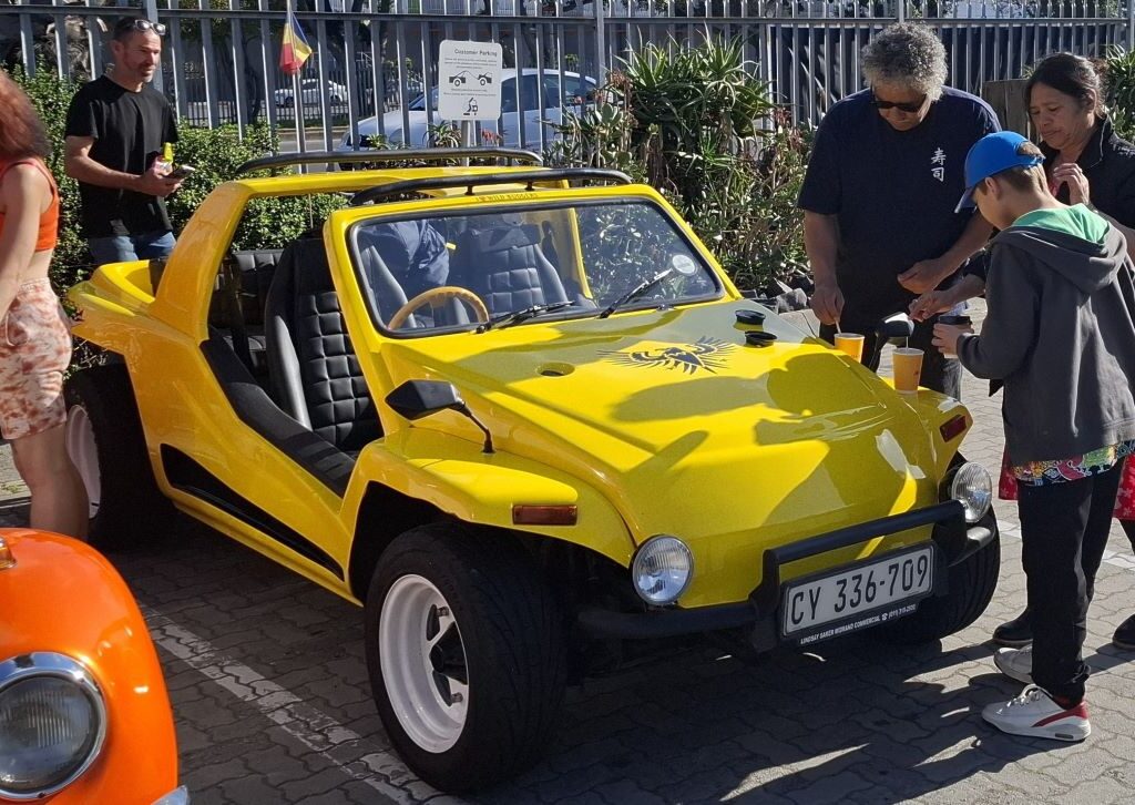 Fabian and his family enjoying coffee with their yellow VW air-cooled Kango beach buggy at the Wild Buggers meeting point.