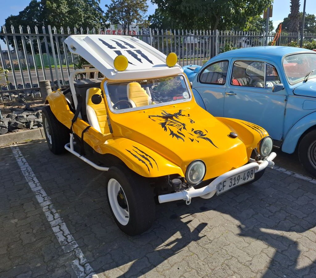 A close-up shot of Chris's yellow VW air-cooled Salamander beach buggy, appropriately named 'Zara's Buggy.'