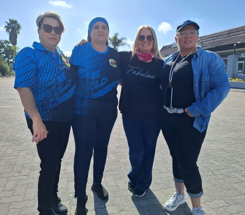 A group of women from the Wild Buggers crew posing for a fun photo at the meeting point for Zara's Run.