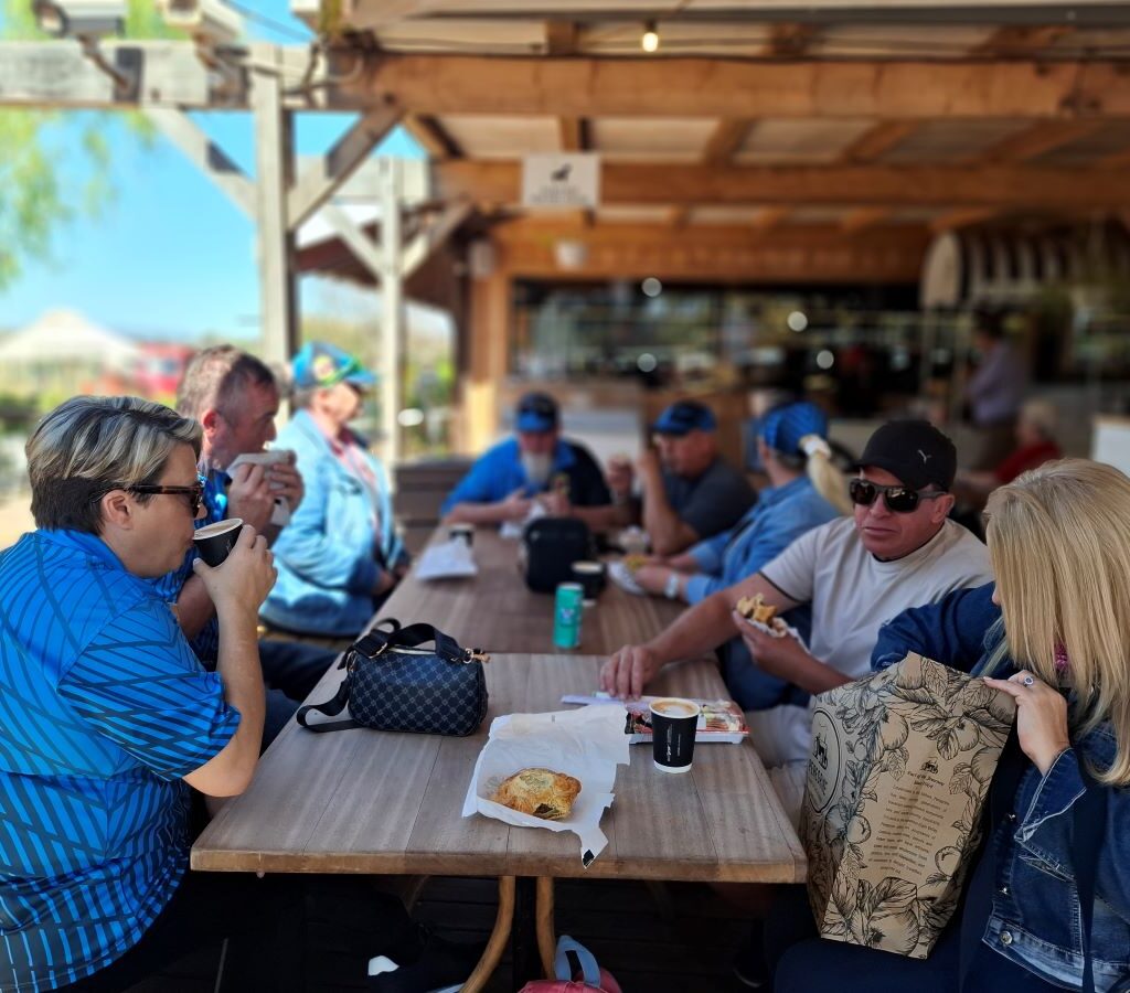 Members of the Wild Buggers club are pictured inside Peregrine Farm Stall, ordering food and drinks during their run.