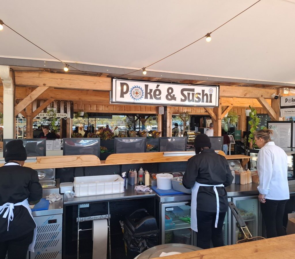 Members of the Wild Buggers club are pictured inside Peregrine Farm Stall, ordering and enjoying sushi during their run.