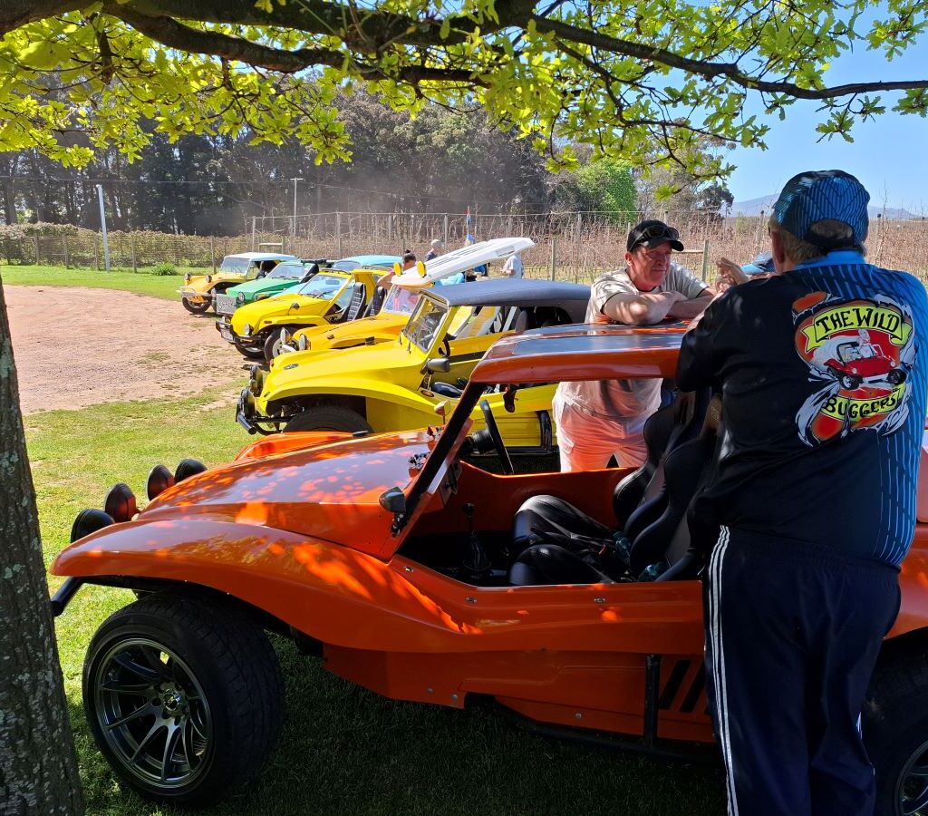 Chris and Brent are pictured leaning on Brent's VW Beach Buggy, "The Wasp," as they chat and relax during a Wild Buggers run.