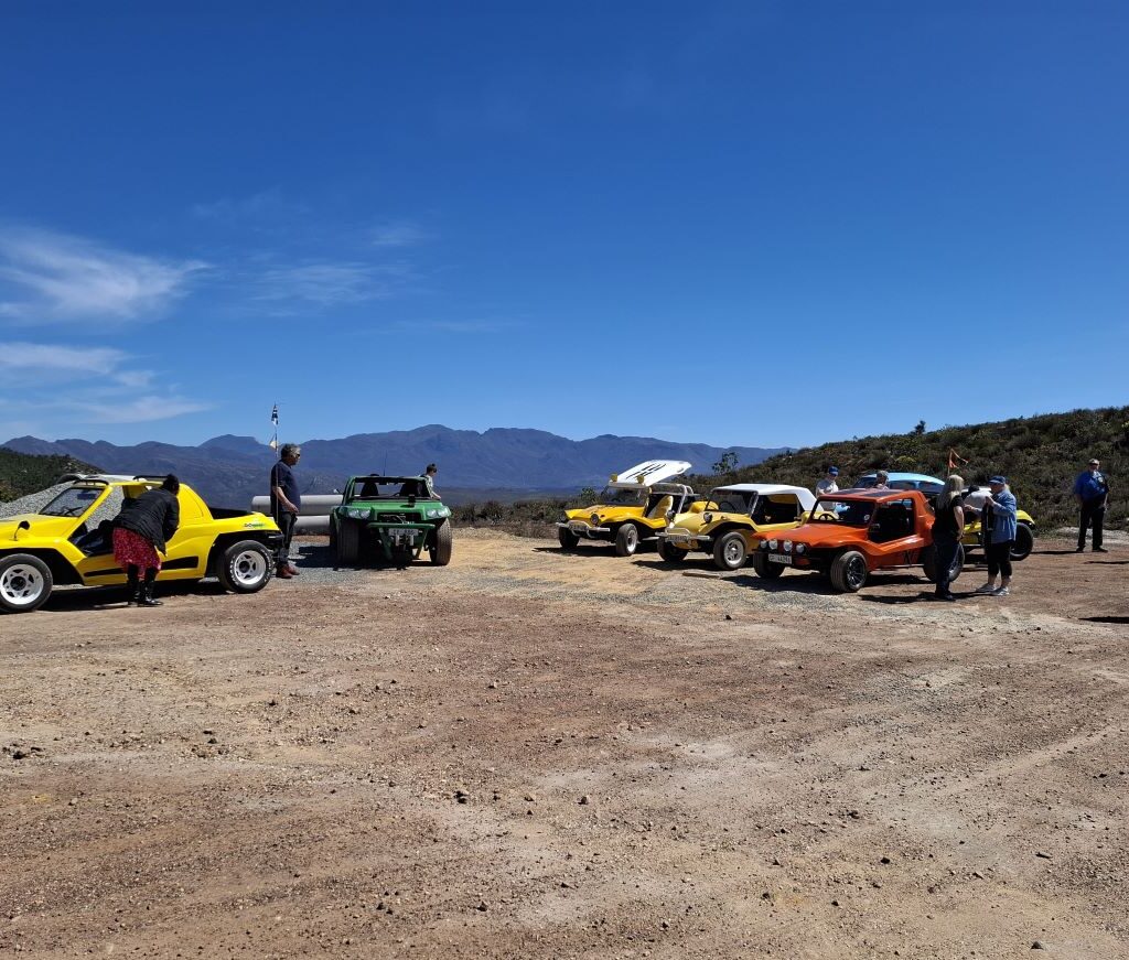 A line of Wild Buggers' VW Air cooled vehicles, including Beach Buggys, are parked at a newly discovered scenic lookout point on the Highlands Road.