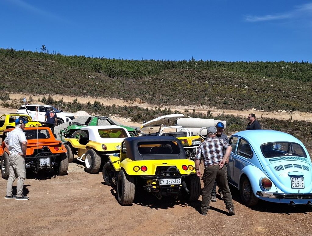 Members of the Wild Buggers club get out of their VW Bugs to take in the view at a scenic lookout point they just found.