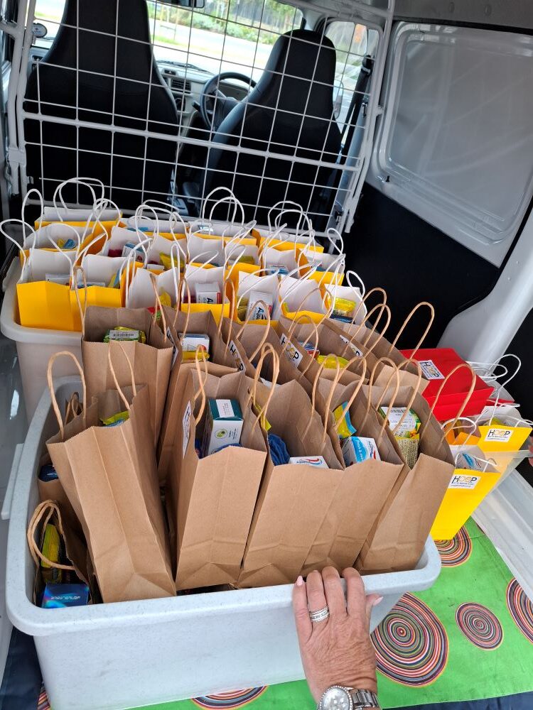 The Wild Buggers Beach Buggy Club charity run receiving HOOP Project donation packs from Bok Radio.