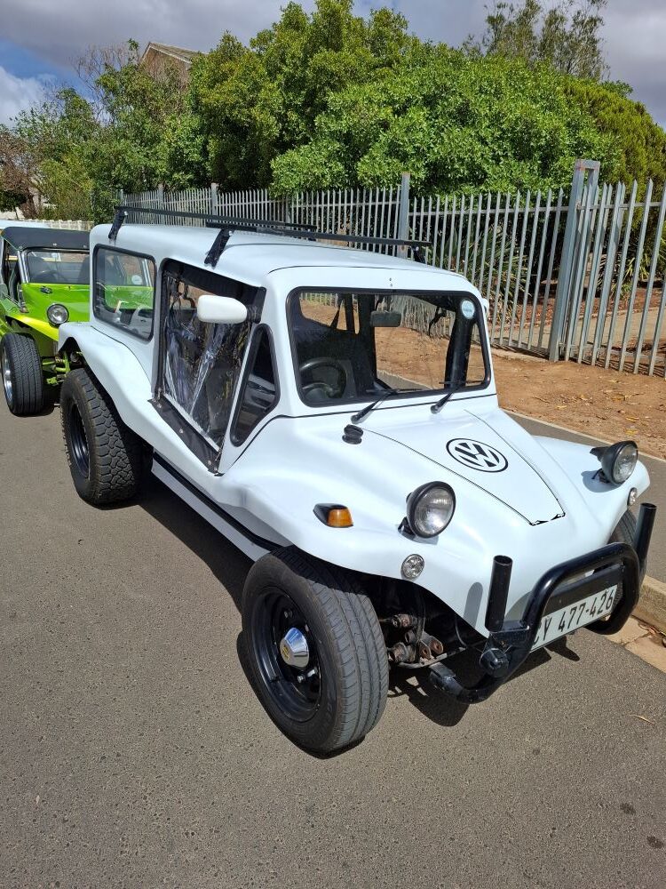 A custom white VW air-cooled Kestrel KartKraft beach buggy with a full hardtop cabin and black bull bar.