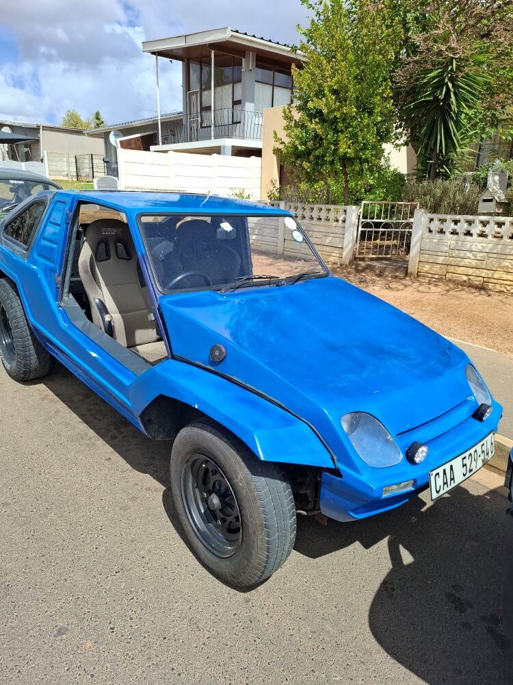 Rhoodie and Yolande Ackerman's custom blue Kango beach buggy with a 1600 VW Golf water-cooled engine conversion.