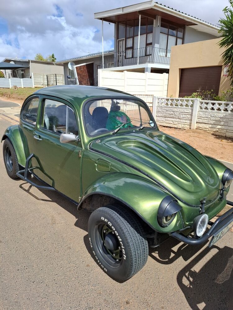 Mickey’s "Dark Side," a metallic green 1974 1600 VW air-cooled Baja Bug with custom off-road modifications.