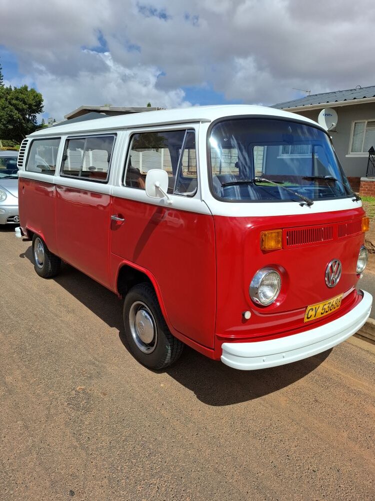 Hein and Louritha’s red and white 1979 2-litre automatic VW Kombi parked on a suburban street during a Wild Buggers club run.