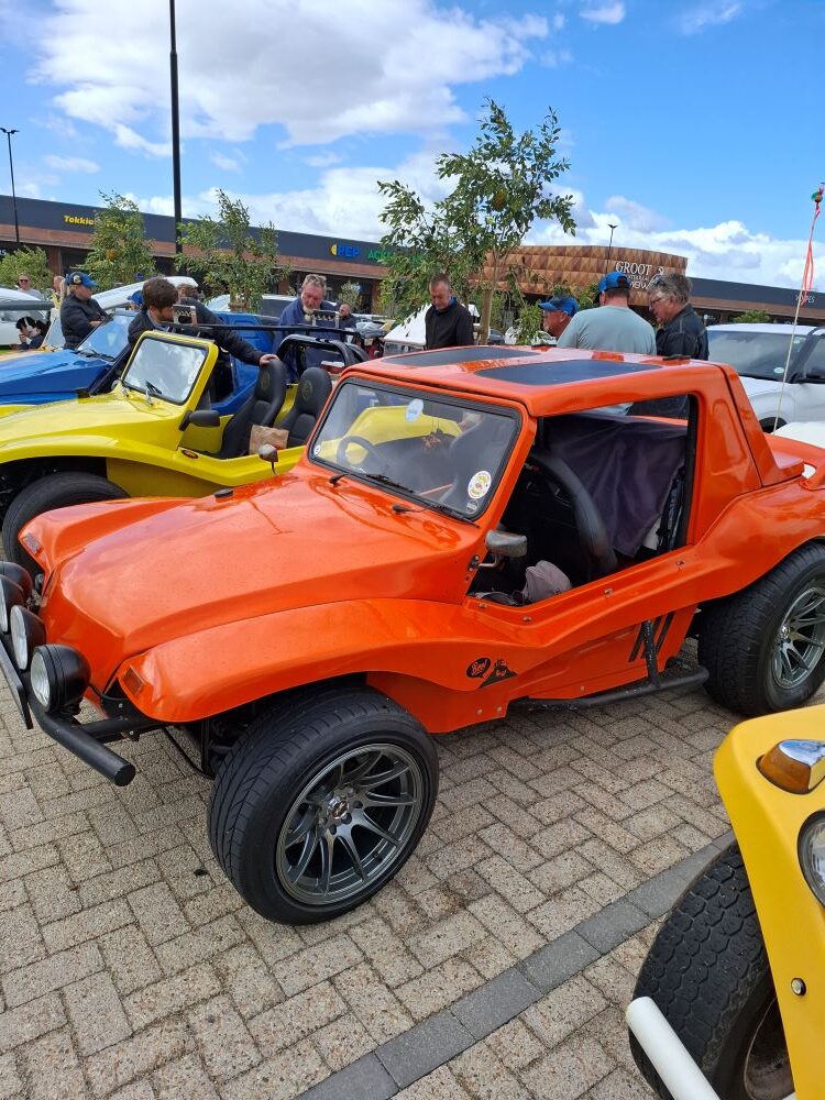 Brent & Sam Van Der Weijde’s customized orange VW Salamander Beach Buggy, "The Wasp," parked at the Wild Buggers Charity Run meeting point.