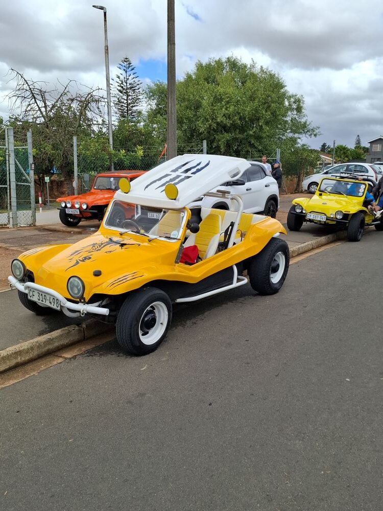 Chris and Sandra Zara’s yellow VW air-cooled Salamander beach buggy, "Zara’s Buggy," parked on the street in Malmesbury.