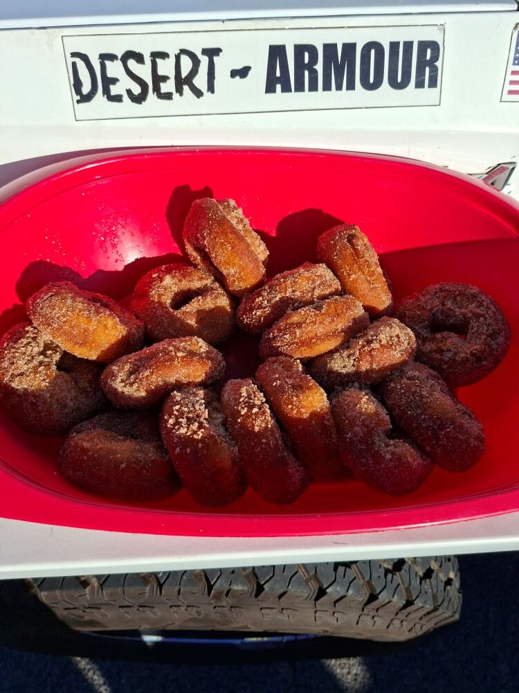 Fresh cinnamon donuts served from a beach buggy tailgate during a Wild Buggers club event in Cape Town.