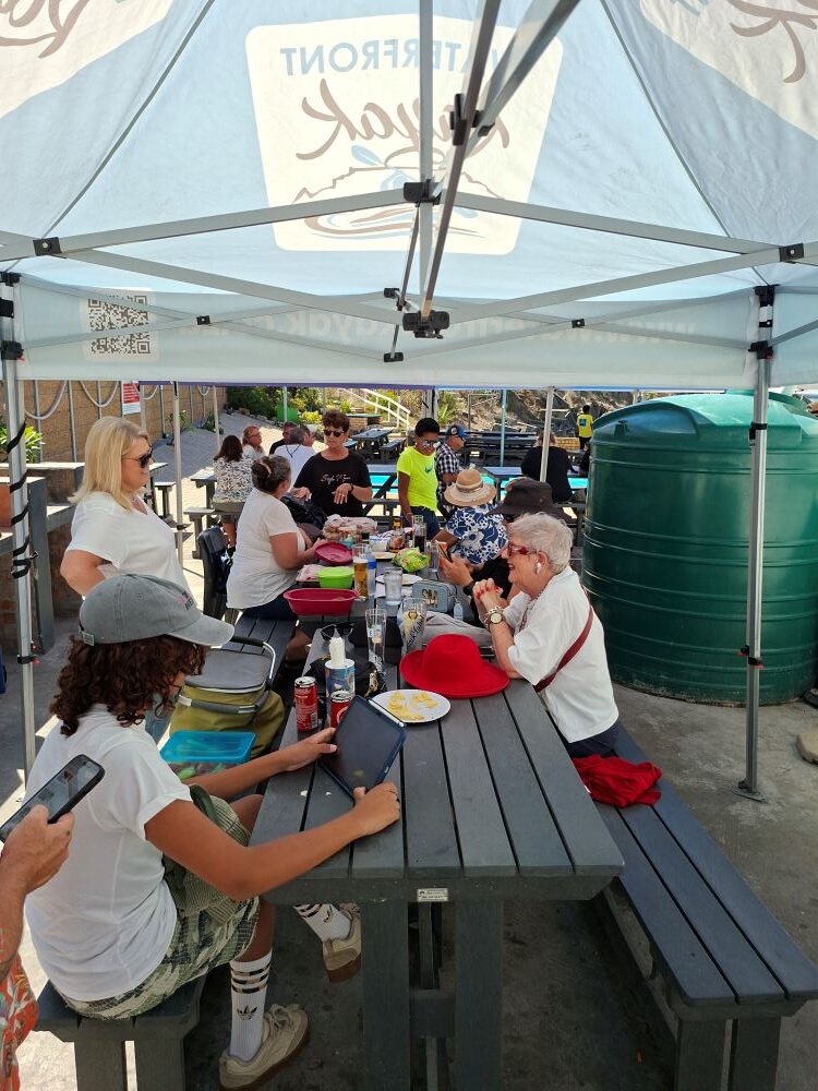 Wild Buggers Beach Buggy Club members enjoying a social afternoon under a gazebo at the Oceana Power Boat Club.