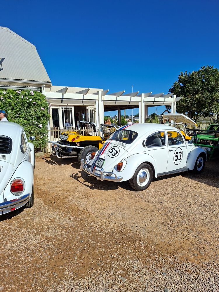 Neil and Maddox’s iconic #53 Herbie VW Beetle with a 1600 air-cooled motor parked at Ou Meul in Melkbosstrand during a Wild Buggers club run.
